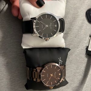 2 Kenneth Cole watches. Brown chain link and black with silver strap watches.